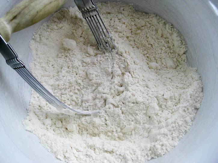 Flour in a bout for Fluffy Buttermilk Biscuits from themerchantbaker.com