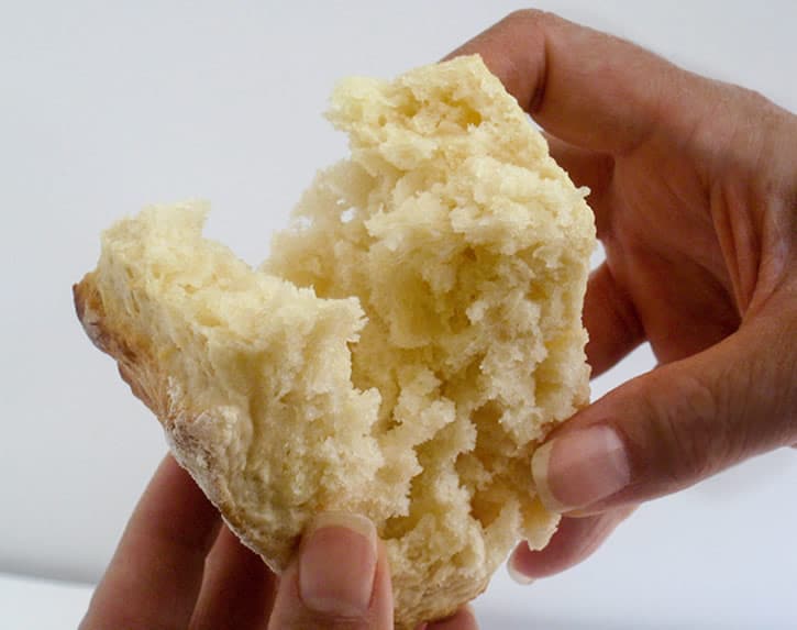 Breaking open a Fluffy Buttermilk Biscuit to show texture from themerchantbaker.com