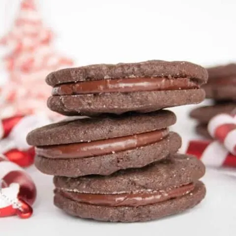 Minty Cocoa Fudge Sandwich Cookies. A tender chocolate cookie filled with a creamy, rich and minty fudge .
