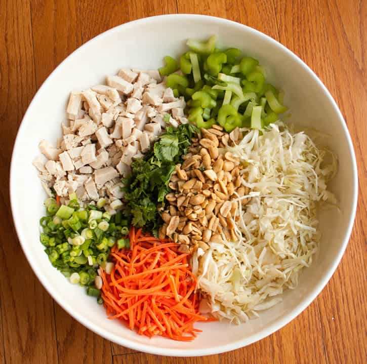 Asian Peanut Chicken Slaw-If you have a Trader Joe's, this recipe makes a tasty dinner in almost no time. There are tons of cheater short cuts in this recipe. Pre-shredded cabbage and carrots, pre-cooked roasted chicken, and a bottled spicy peanut dressing will give you the head start to this quick and delicious main dish salad. I love serving the cold salad over hot rice. This recipe is in regular rotation in my house.
