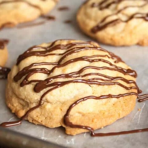 Soft Chewy Peanut Butter Chip Cookies. A satisfyingly thick and chewy cookie, drizzled with melted chocolate.