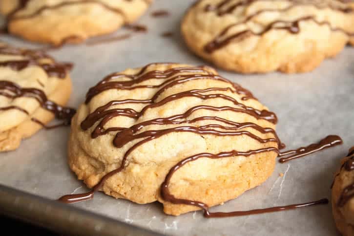Soft Chewy Peanut Butter Chip Cookies. A satisfyingly thick and chewy cookie, drizzled with melted chocolate.