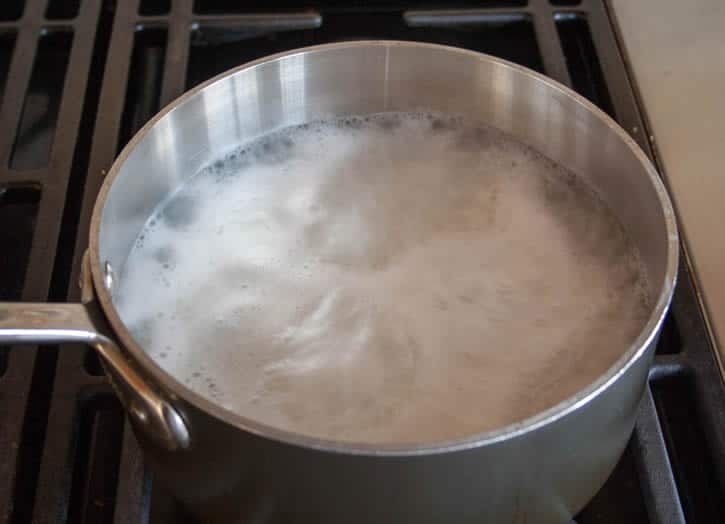 Perfect White Rice boiling in a pot from themerchantbaker.com