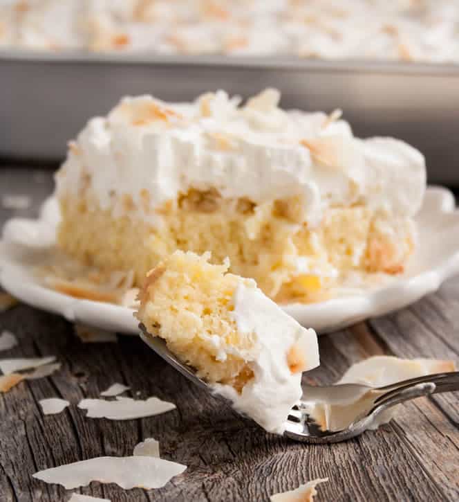 Pineapple Coconut Tres Leches Cake. A twist on the classic made with coconut milk, a layer of crushed pineapple and topped with toasted coconut!