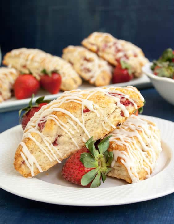 Two Fresh Strawberry Cream Scones on a plate