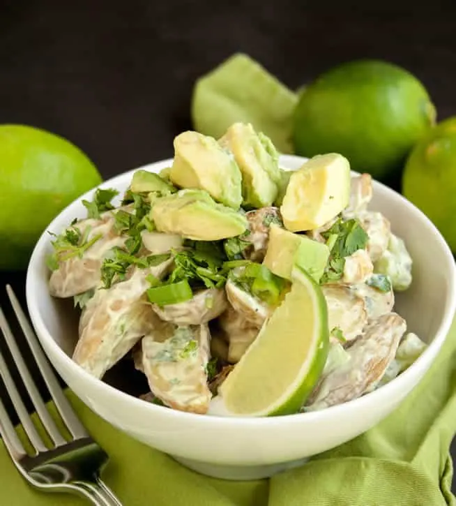Roasted Potato Salad with Avocado Lime Dressing-I pretty much have never met a potato salad I didn't like. I created this one as a fun twist on classic potato salad. I love the flavor and texture of roasted potatoes in this dish. And where there are avocados, limes and cilantro involved? You just know it's gonna be good!