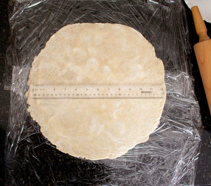 Raw dough for Blueberry Galette flattened with and ruler to show size from themerchantbaker.com
