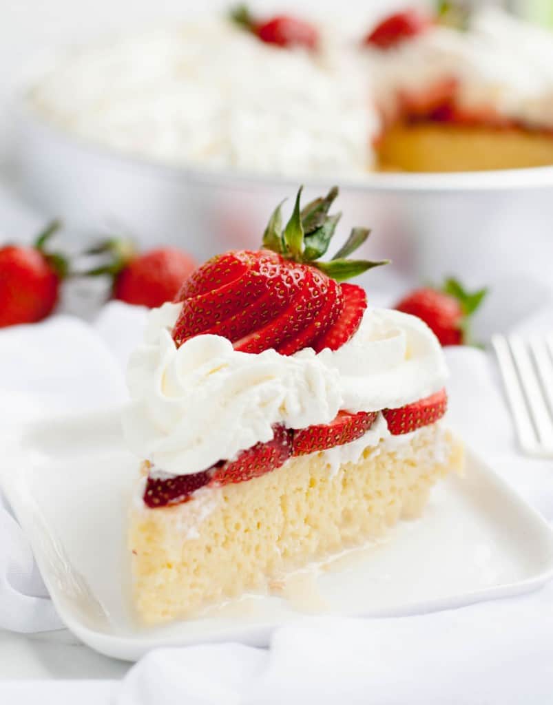 Strawberry Tres Leches Cake takes the classic combo of strawberries and cream to a new level. Berries are a perfect match for this rich and creamy cake!