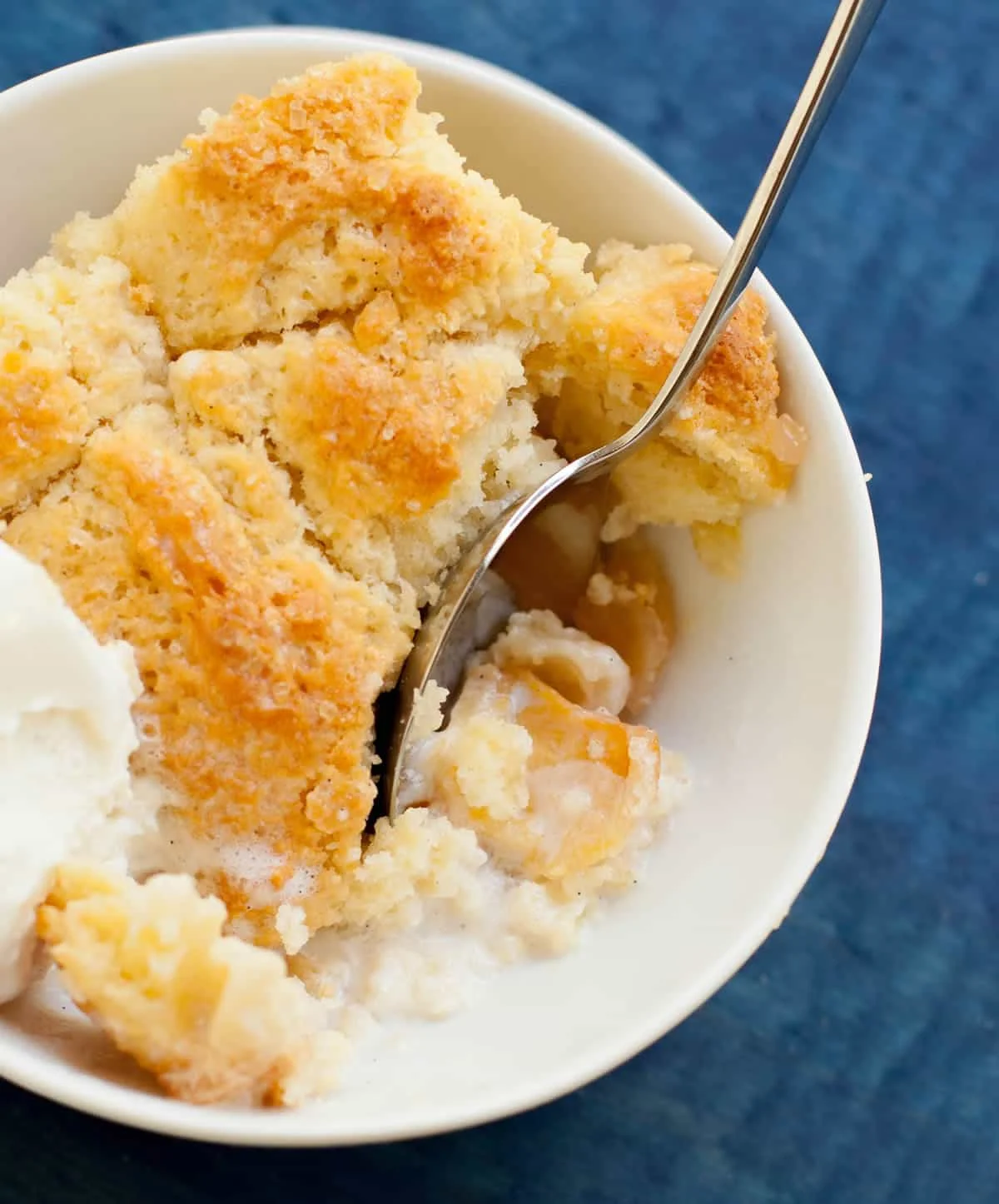 Georgia Peach Cobbler. Fresh peaches, lightly spiced and sweetened with two kinds of sugar, are baked under a delicious sweet biscuit topping!