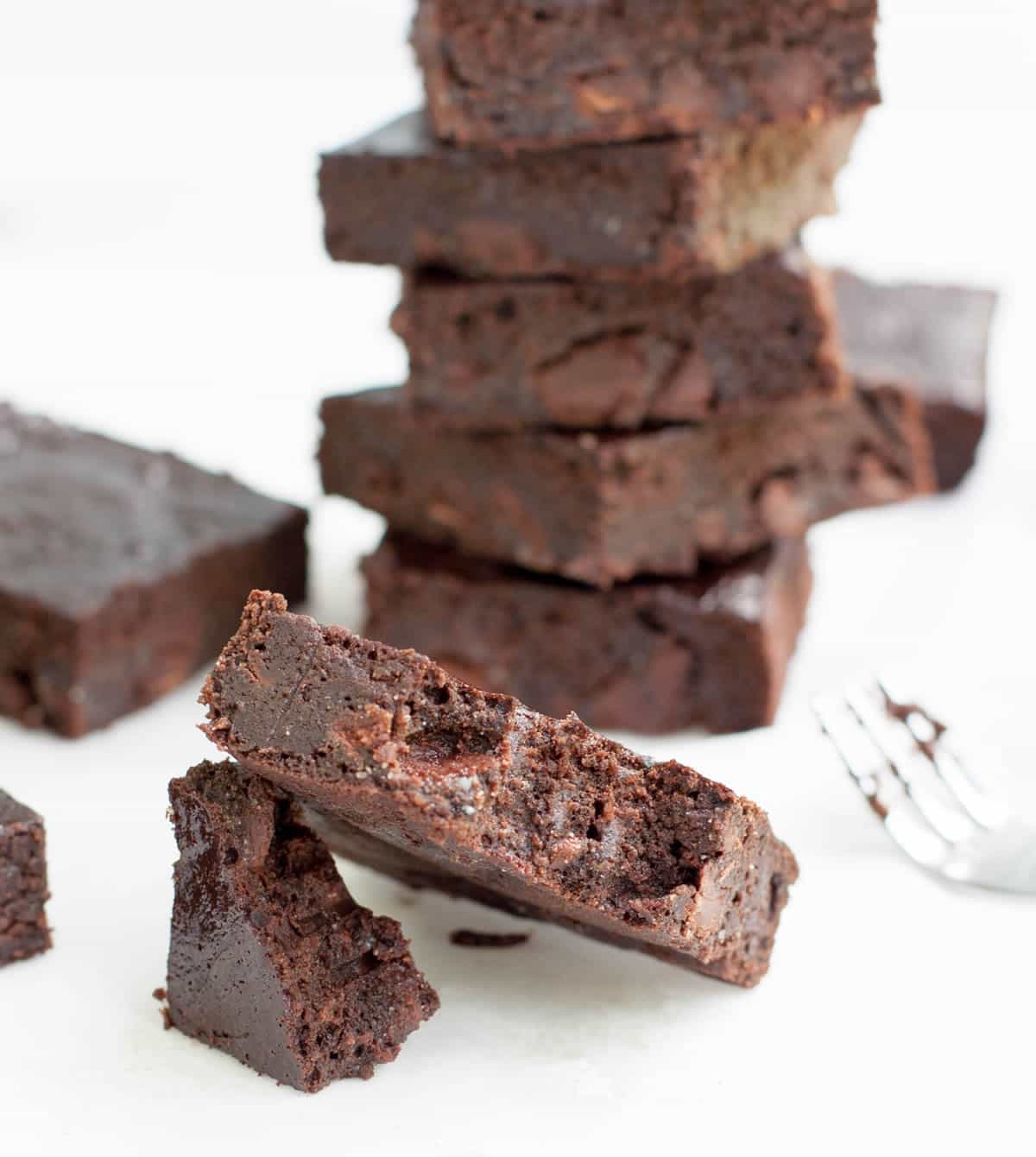 Fudgy Zucchini Brownies mix up easily in your food processor! (No grating!) Lower in sugar, flour and fat than many traditional brownie recipes.