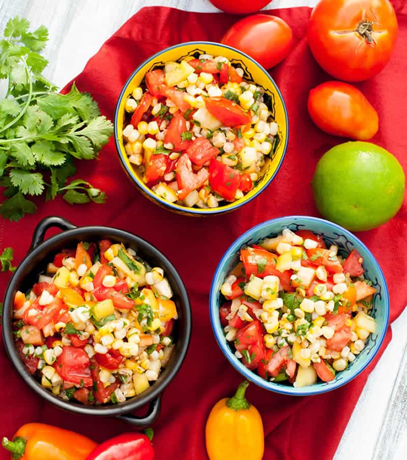 Grilled Corn Salad. Grilled corn, tomatoes, peppers and scallions tossed with cilantro, lime, salt and pepper. Great as a salad or side dish!