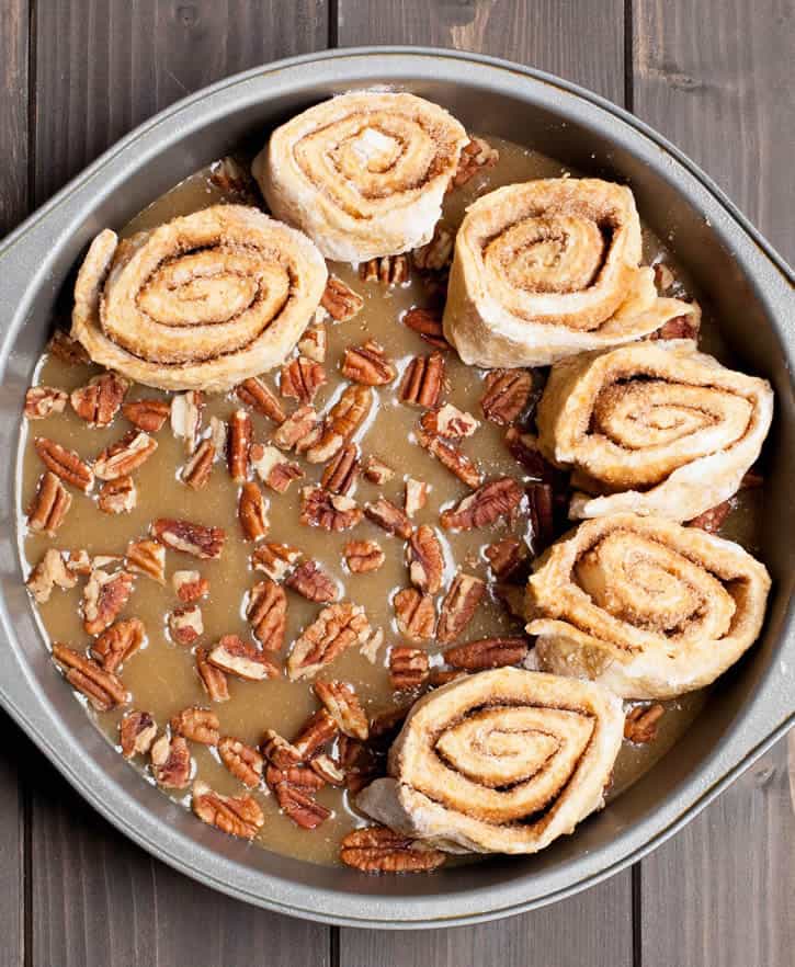 Pumpkin Biscuit Sticky Buns. No yeast, no rising, no waiting! Spiced and fragrant with orange zest, pecans and maple caramel sauce top it off!