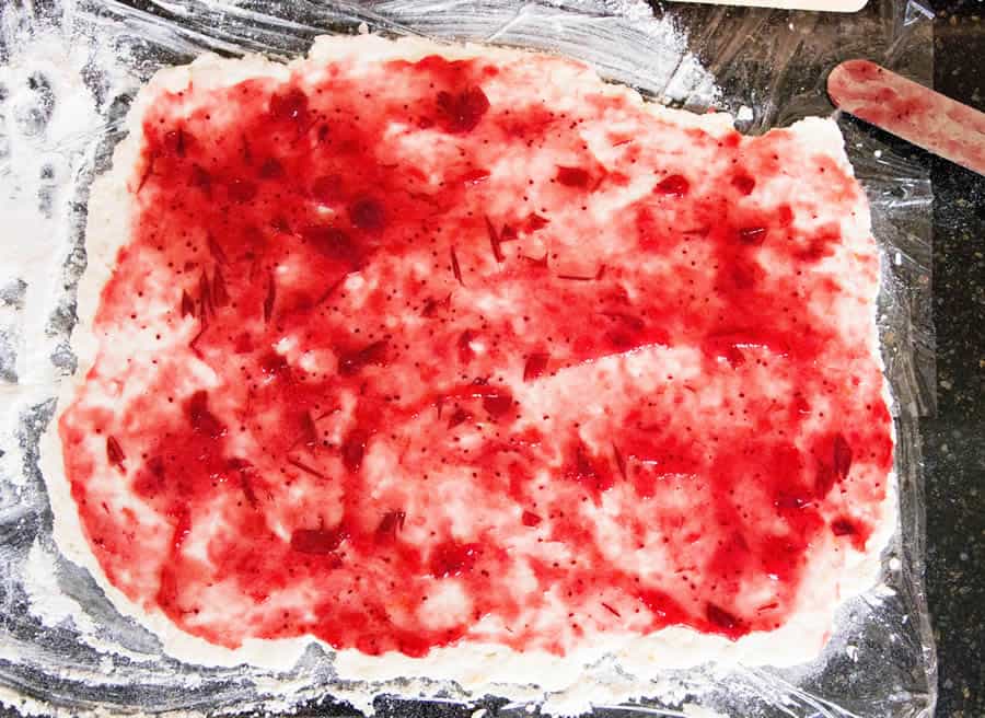 Cranberry Orange Sweet Roll. No yeast, no rising, no waiting! Just fluffy biscuit dough filled with cranberry sauce and flavored with fresh orange zest.