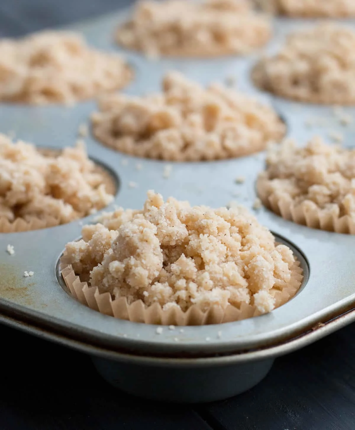 Egg Nog Crumb Muffins, rich with egg nog, topped with big chunks of sweet buttery crumbs, then graced with a dusting of confectioner's sugar.