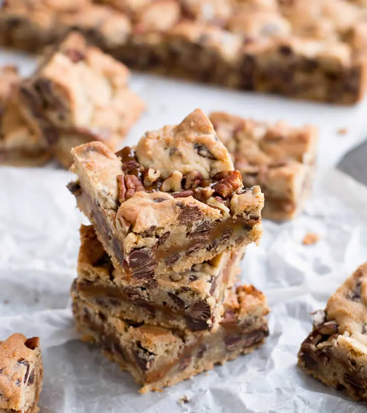 Chocolate Chip Dulce de Leche Bars. Creamy sweet milk caramel, baked between chocolate chip cookie dough. Add pecans for turtle lovers!