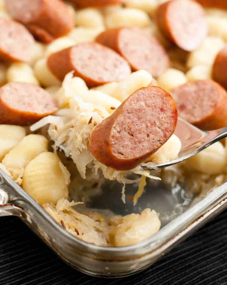 Smoked Sausage, Gnocchi and Sauerkraut with brown sugar and caraway seeds pairs with juicy sausage and hearty potato dumplings. An easy weeknight meal!