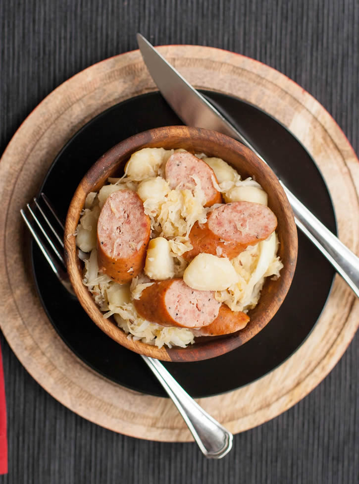 Smoked Sausage, Gnocchi and Sauerkraut with brown sugar and caraway seeds pairs with juicy sausage and hearty potato dumplings. An easy weeknight meal!