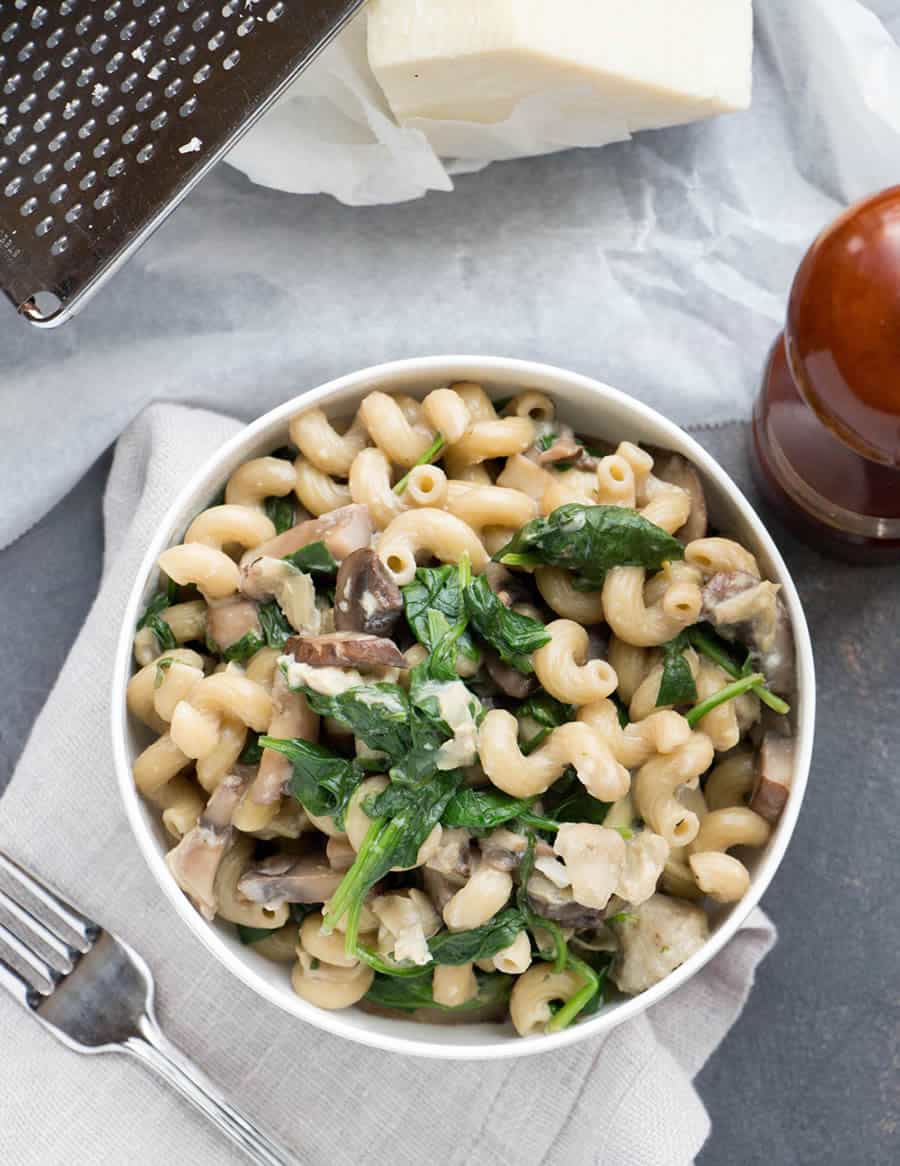 One Pot Mushroom, Spinach, Artichoke Pasta. Full of veggies and savory mushrooms. Grated romano cheese and a bit of cream make this a hearty one pot meal.
