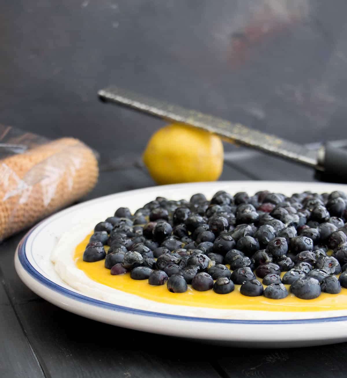 Lemon Blueberry Cheesecake Dip. No bake cheesecake layered with lemon curd and fresh blueberries. It's a dip that looks like a fancy dessert!