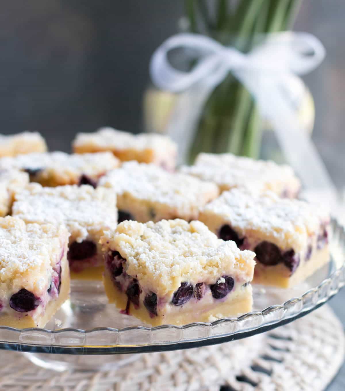 Lemon Blueberry Shortbread Bars. A thick, soft shortbread crust is topped with a lemony custard, fresh blueberries and a lemon crumb topping!