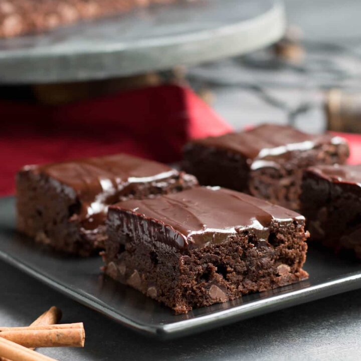 Mayan Brownies. Ground cinnamon, cinnamon chips and cayenne gently warm this deliciously spiced brownie. Fudgy cinnamon infused ganache tops it off!