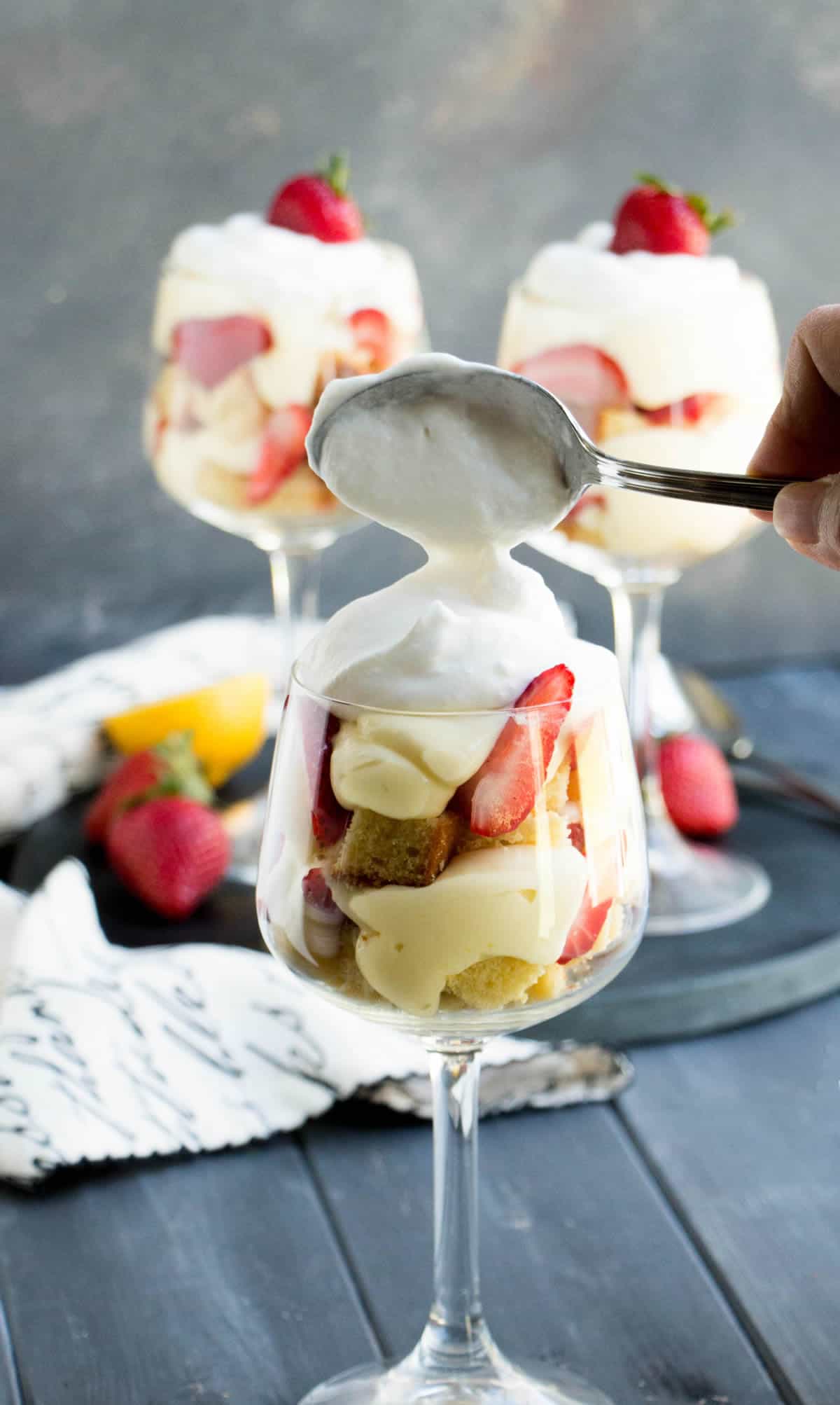 Strawberry Lemon Pound Cake Trifles. Triple citrus pound cake is layered with a no bake lemon curd cheesecake filling, fresh strawberries and whipped cream!