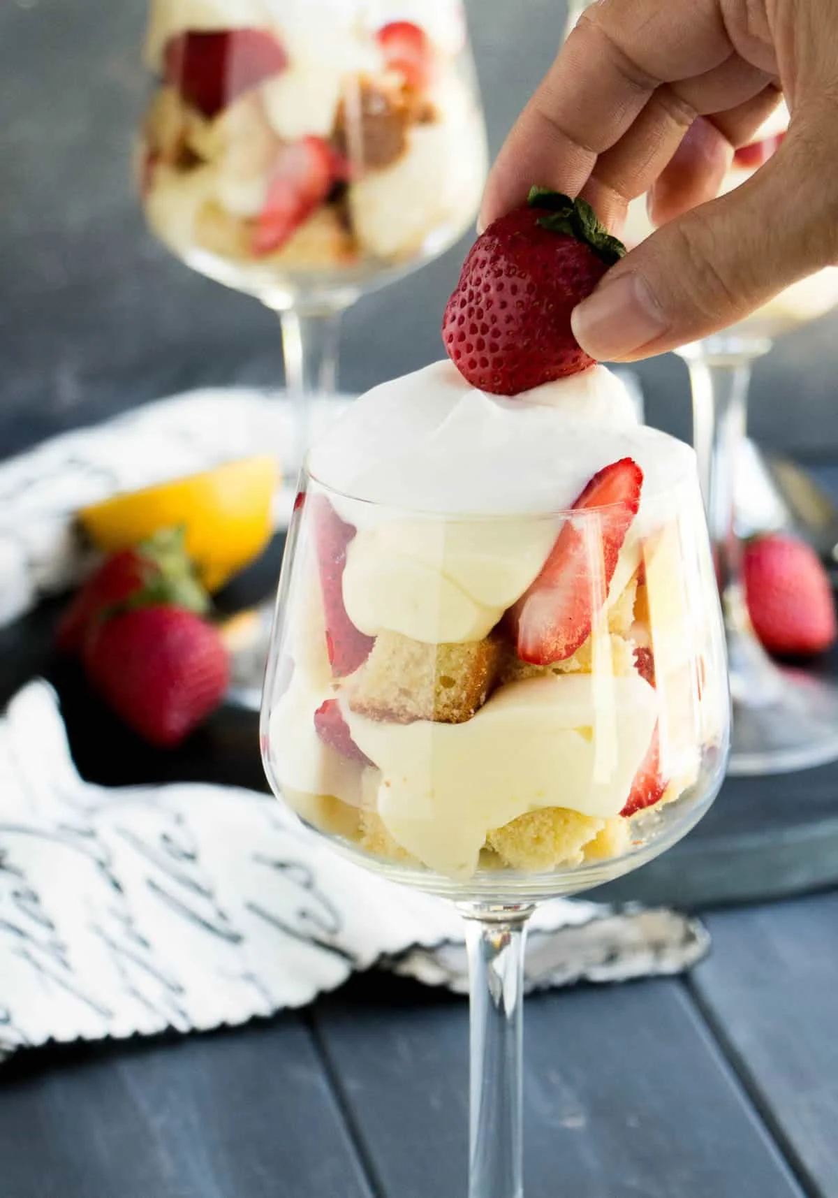 Strawberry Lemon Pound Cake Trifles. Triple citrus pound cake is layered with a no bake lemon curd cheesecake filling, fresh strawberries and whipped cream!