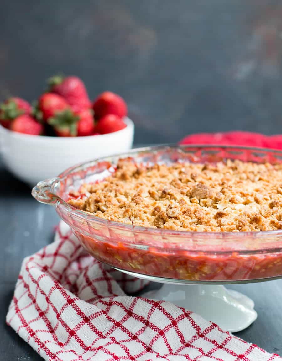Strawberry Rhubarb Crisp. Fresh strawberries and tart rhubarb are topped with a sweet, buttery, crisp oatmeal topping for a delicious, easy to make dessert!