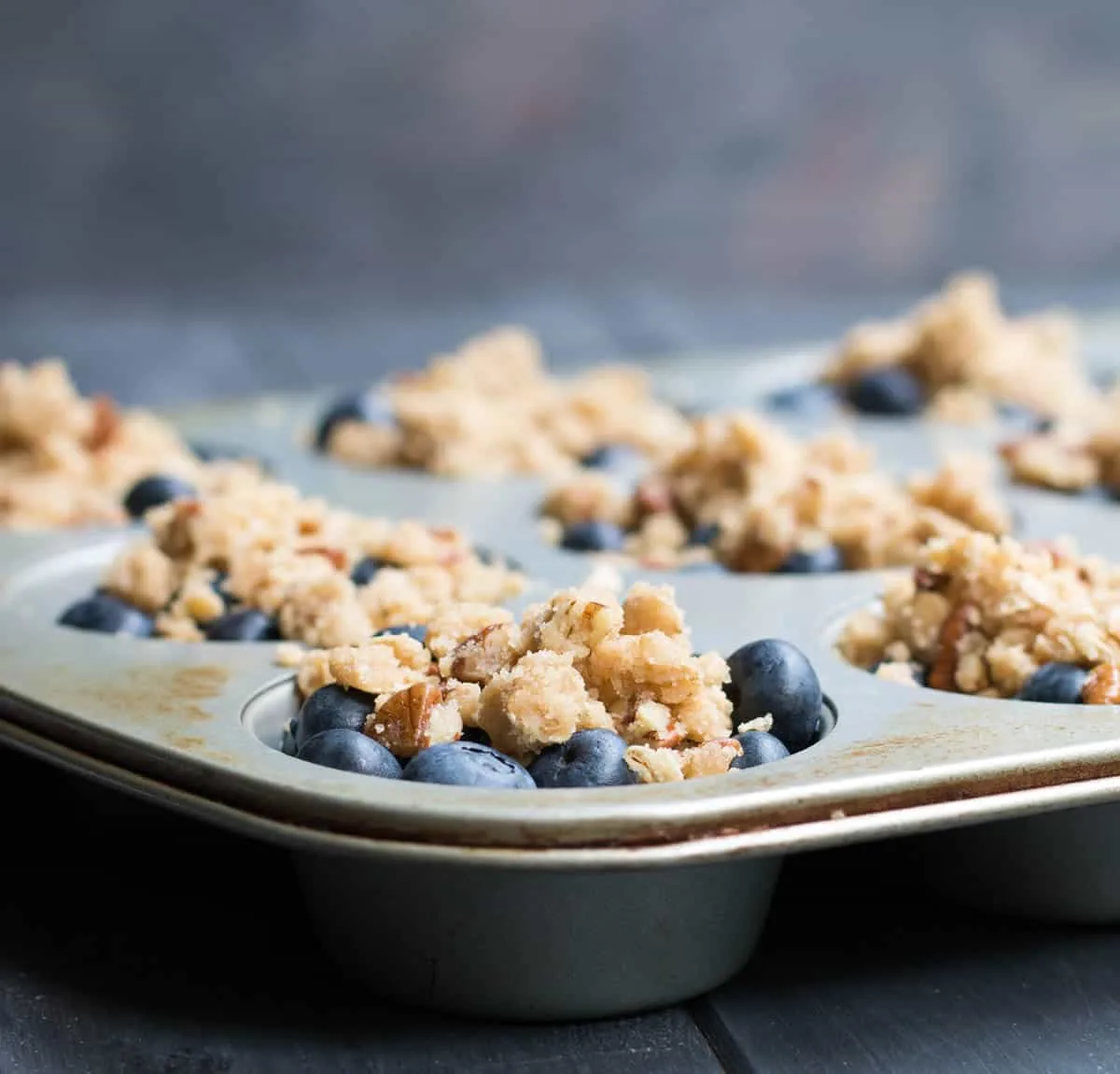 Blueberry Pie Baked Oatmeal. A pile of fresh blueberries and buttery crumb topping create a delicious fruity pie layer on top of hearty baked oatmeal.