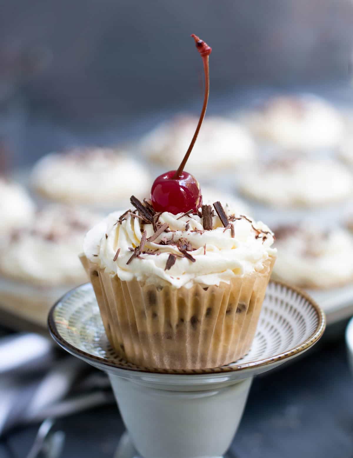 No Bake Ice Box Cannoli Cupcakes. Easy, one bowl ricotta filling is layered with vanilla wafers, topped with whipped cream, chocolate shavings and a cherry!
