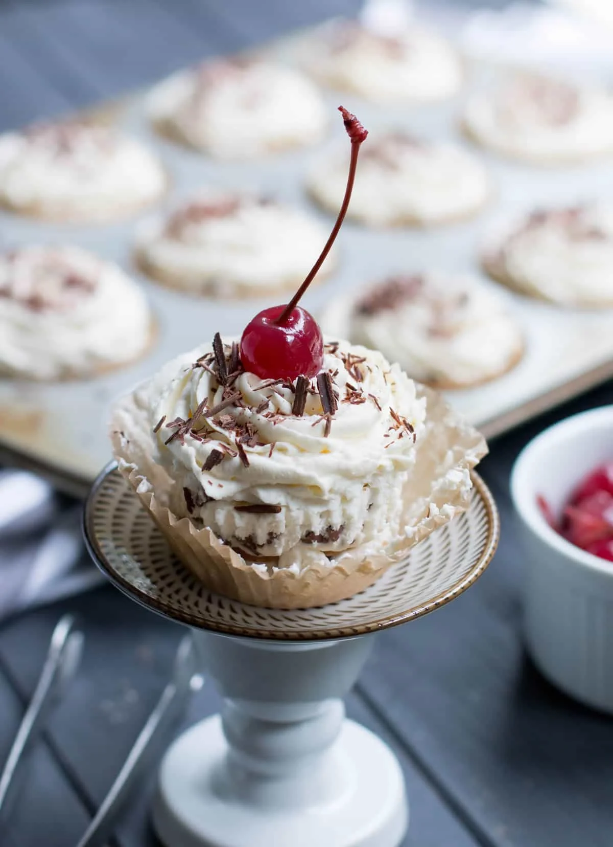 No Bake Ice Box Cannoli Cupcakes. Easy, one bowl ricotta filling is layered with vanilla wafers, topped with whipped cream, chocolate shavings and a cherry!