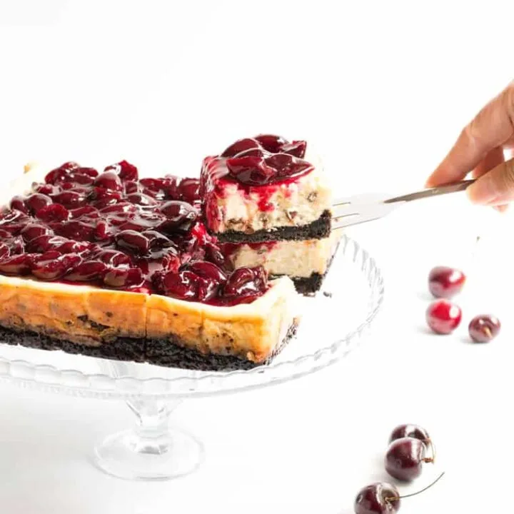 Chocolate Chip Cherry Cheesecake. A fresh sweet cherry sauce tops this easy to make cheesecake. A super fudgy cookie crust takes it over the top!