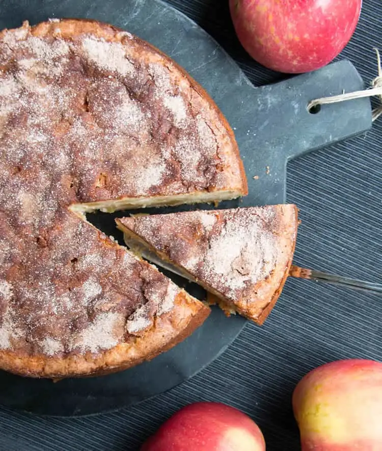 Cinnamon Apple Cake. Chock full of apples, this cake gets a wonderful richness from cream cheese and a spicy sweetness from a dusting of cinnamon sugar.