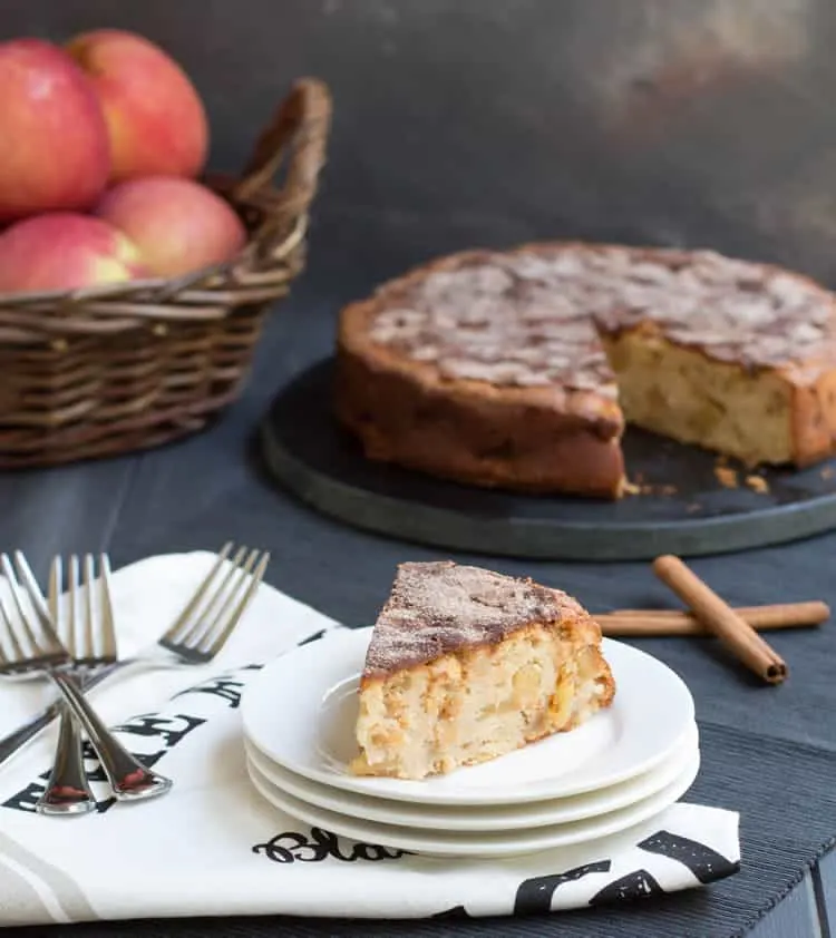 Cinnamon Apple Cake. Chock full of apples, this cake gets a wonderful richness from cream cheese and a spicy sweetness from a dusting of cinnamon sugar.