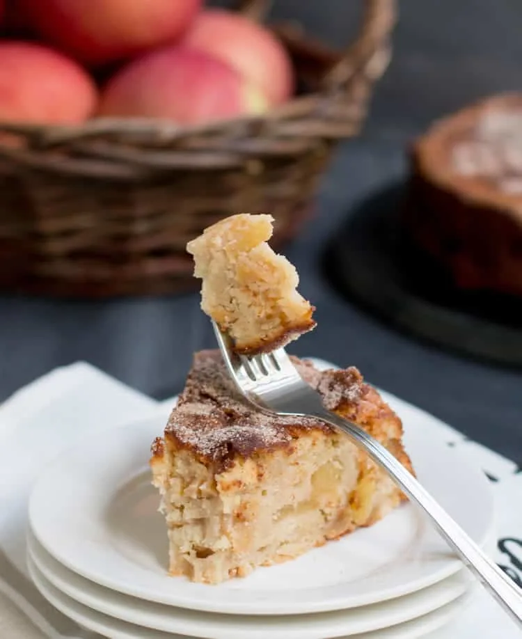 Cinnamon Apple Cake. Chock full of apples, this cake gets a wonderful richness from cream cheese and a spicy sweetness from a dusting of cinnamon sugar.