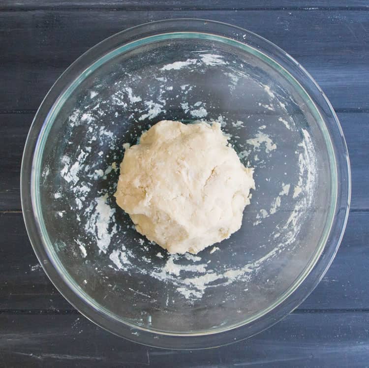 Ball of dough to make Easy All Butter Pie Crust from themerchantbaker.com