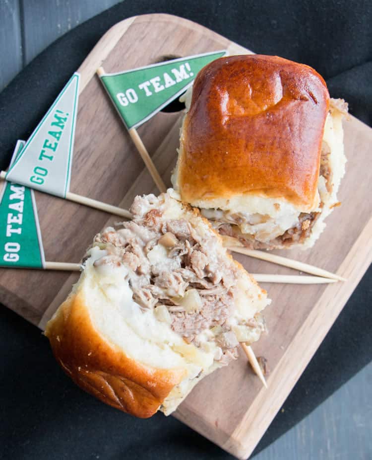 Philly Cheesesteak Sliders. Tender shaved steak, fried onions and mushrooms, melty cheese and a buttery toasted bun make these sliders a delicious choice for game day. Free printable pennants make them fun!