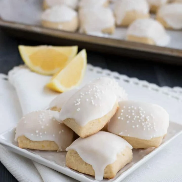 Iced Lemon Pillow Cookies. A soft, petite, pillow shaped cookie, flavored with fresh lemon zest and then coated in fresh lemon icing. A perfect tea cookie!