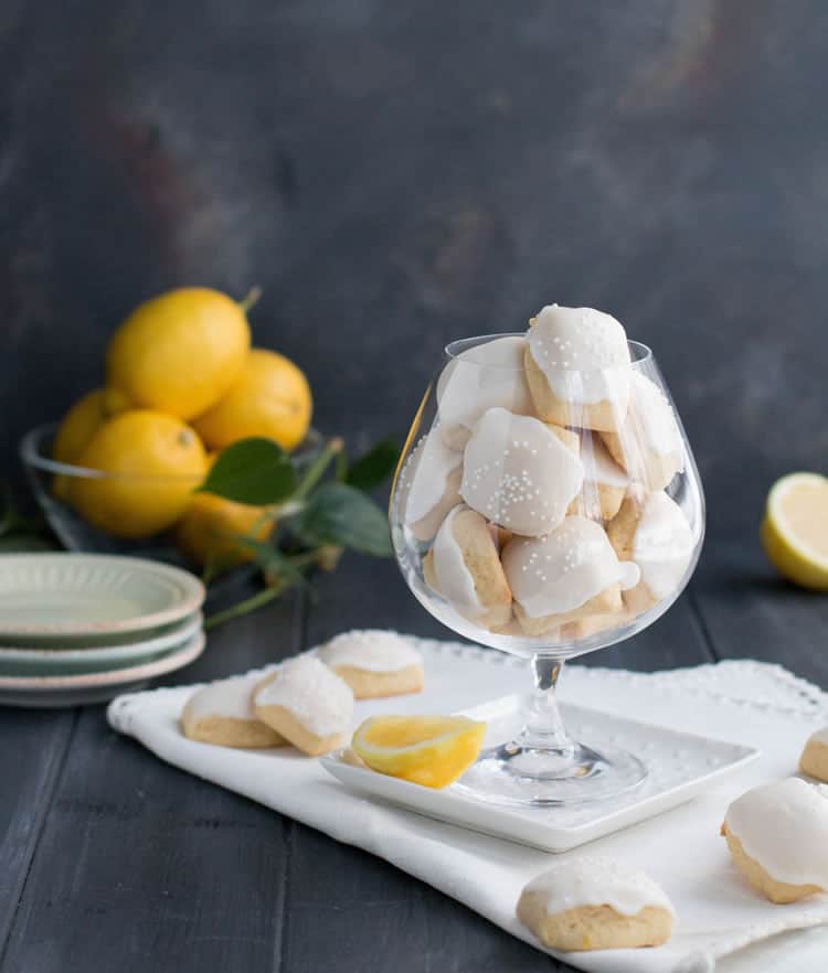 Iced Lemon Pillow Cookies. A soft, petite, pillow shaped cookie, flavored with fresh lemon zest and then coated in fresh lemon icing. A perfect tea cookie!