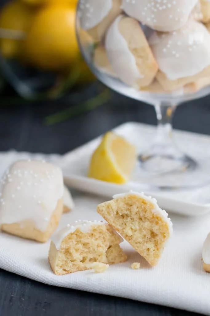 Iced Lemon Pillow Cookies. A soft, petite, pillow shaped cookie, flavored with fresh lemon zest and then coated in fresh lemon icing. A perfect tea cookie!