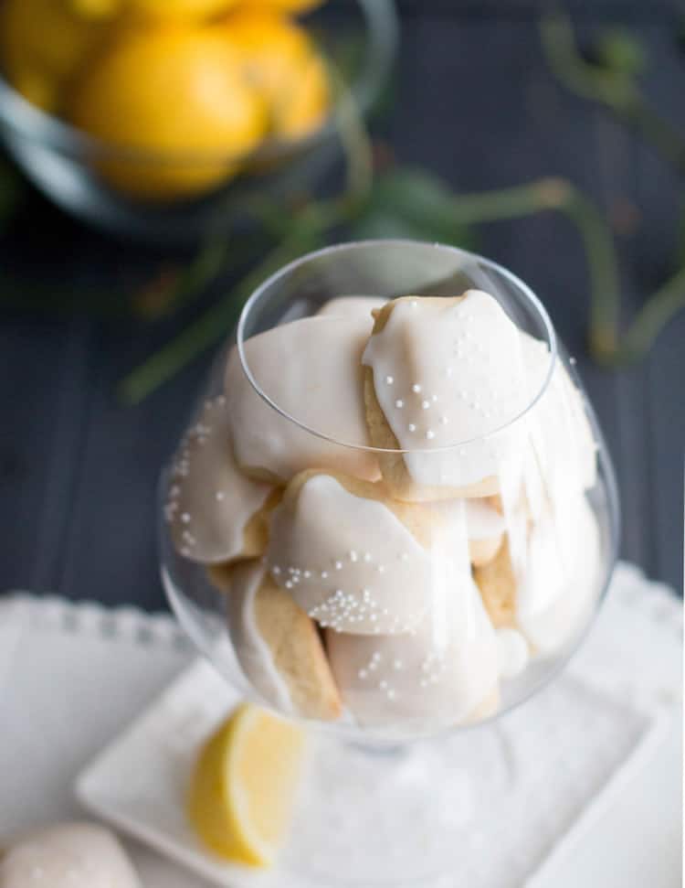 Iced Lemon Pillow Cookies. A soft, petite, pillow shaped cookie, flavored with fresh lemon zest and then coated in fresh lemon icing. A perfect tea cookie!