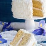 Mandarin Orange Pineapple Cream Cake. Layers of mandarin orange cake, filled with pineapple coconut pastry cream and covered in pineapple whipped cream and coconut chips. Perfect for Easter or Spring gatherings.