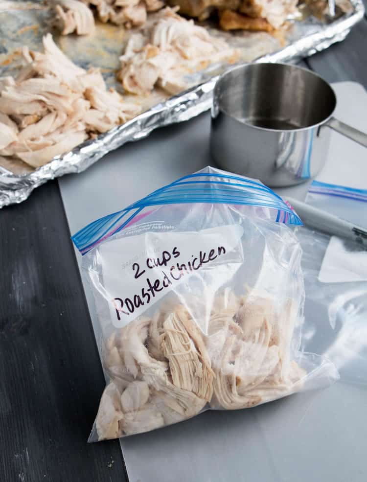 Showing 2 cups of Recipe Ready Roasted Chicken in a storage bag from themerchantbaker.com
