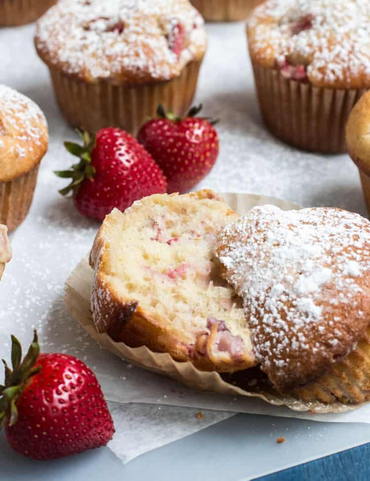 Fresh Strawberry Muffins sliced in half to show texture from themerchantbaker.com
