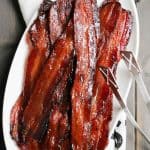 Brown Sugar Maple Glazed Bacon is oven baked and uses just three simple ingredients. Perfect for breakfast or as a fun addition to sweet and savory recipes.