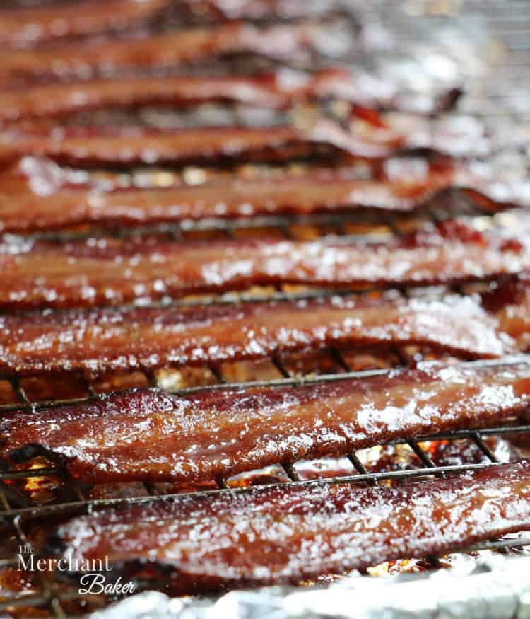 Brown Sugar Maple Glazed Bacon fully cooked on a baking dish from themerchantbaker.com