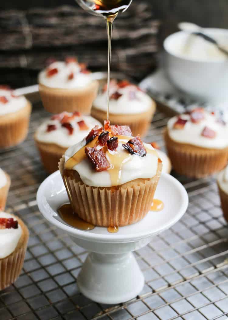 Glazed Bacon Maple Syrup Muffins, made with pure maple syrup and butter, topped with glazed bacon. Perfect sweet and savory treat for breakfast or brunch!