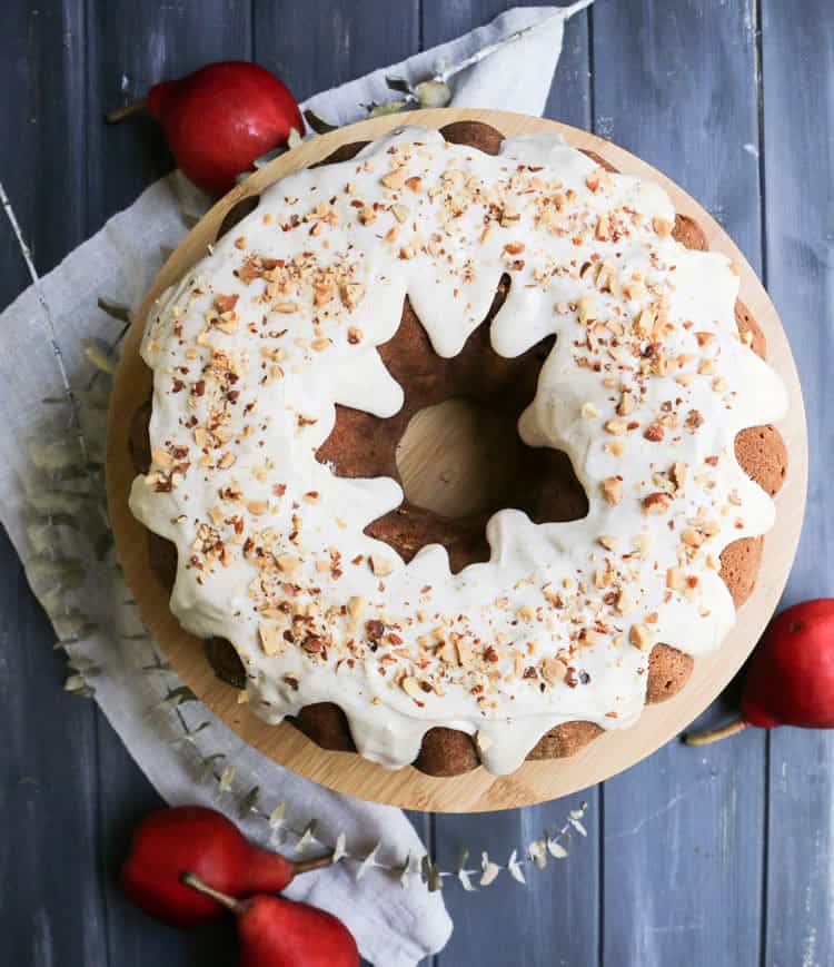 Chai Spiced Pear Bundt Cake is filled with fresh ripe pears and gently spiced with cinnamon, cardamom and cloves. A spiced icing is accented with chai tea.