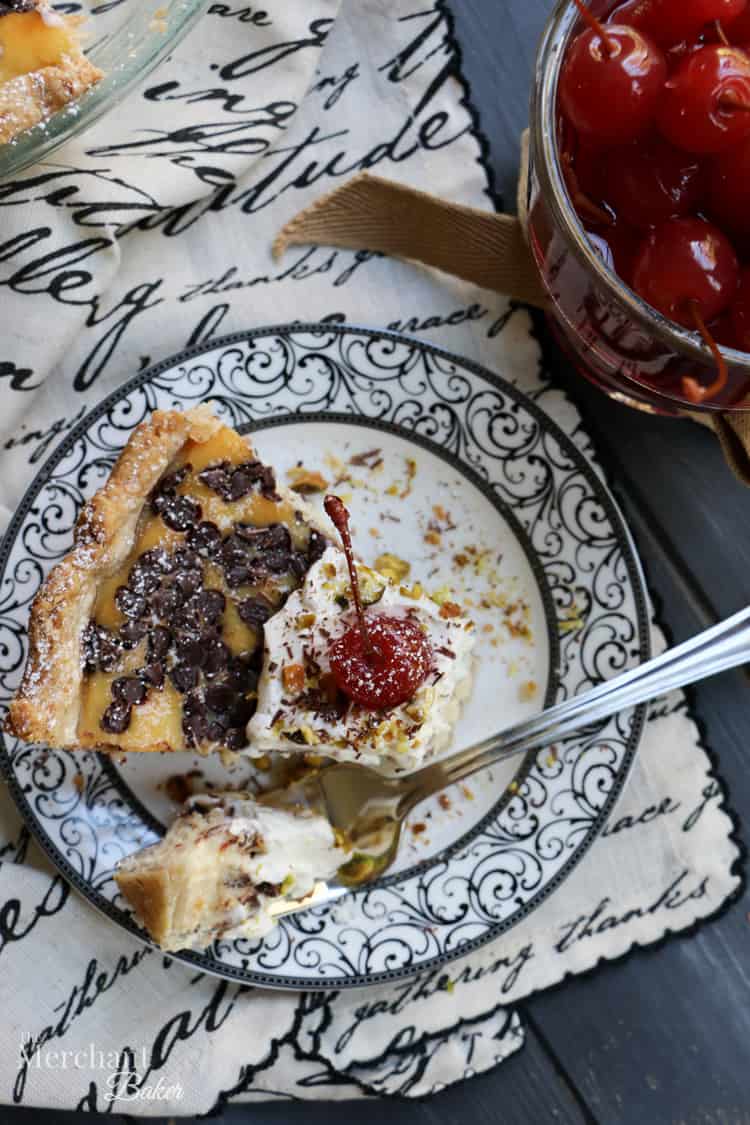 Chocolate Chip Cannoli Pie. Easy one bowl filling with just five ingredients! Pile on fresh whipped cream, chopped pistachios and don't forget the cherry!