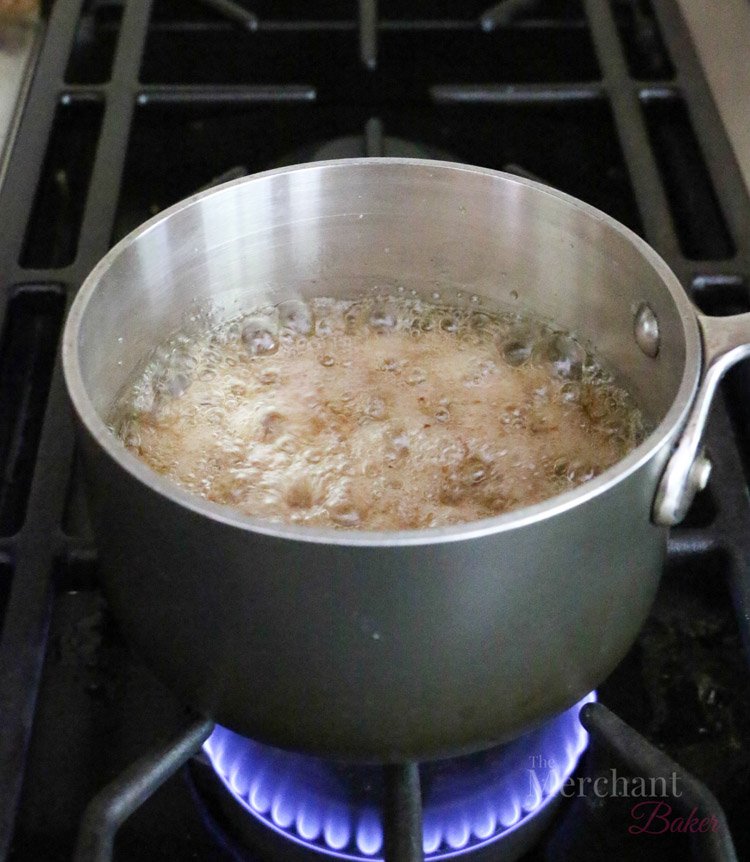walnut syrup boiling in a saucepan